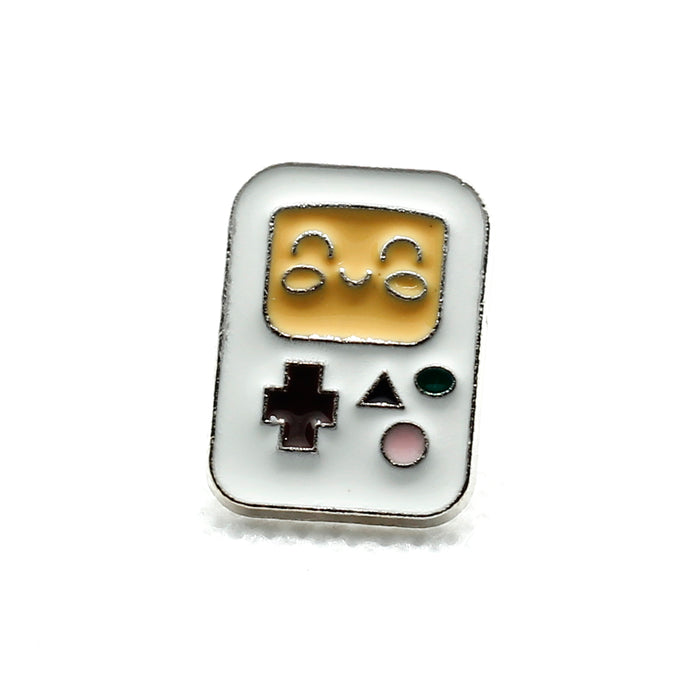 front of badge - an old school gameboy style console