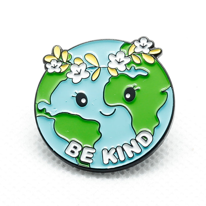 front of badge showing planet earth and the words be kind